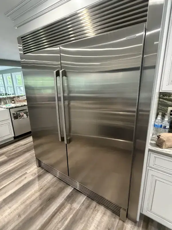 Built-in stainless refrigerator serviced on site