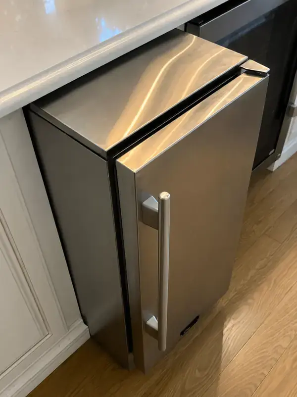 Undercounter ice maker repair in a home bar